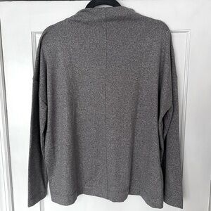 Tunic style mock neck sweater with an oversized feel